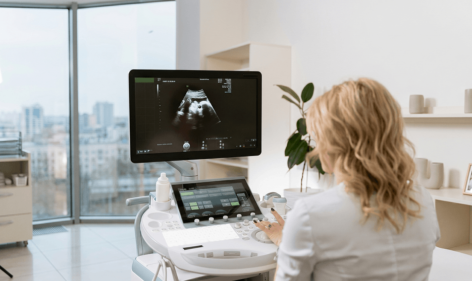 Healthcare professional reviewing patient scans