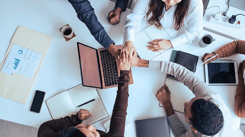 Brainspack LLP team collaborating around a table