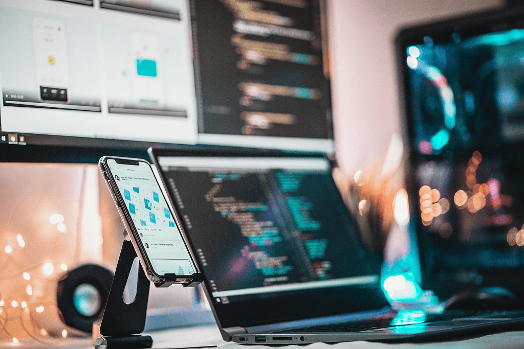 Cross-platform app development workspace with code and app previews on multiple screens